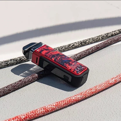 SMOK NORD X 60W Pod System in red-black design resting on boat deck, highlighting rugged IP67 water-resistant build.