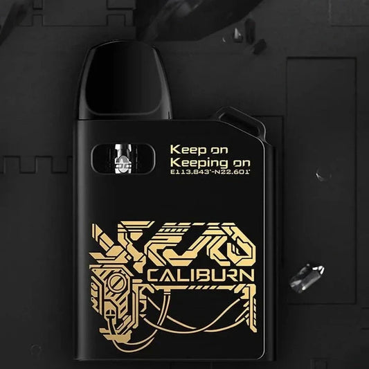 Black Uwell Caliburn AK2 15W Pod System with gold circuit design, featuring 2mL pod and 520mAh battery for portable vaping.
